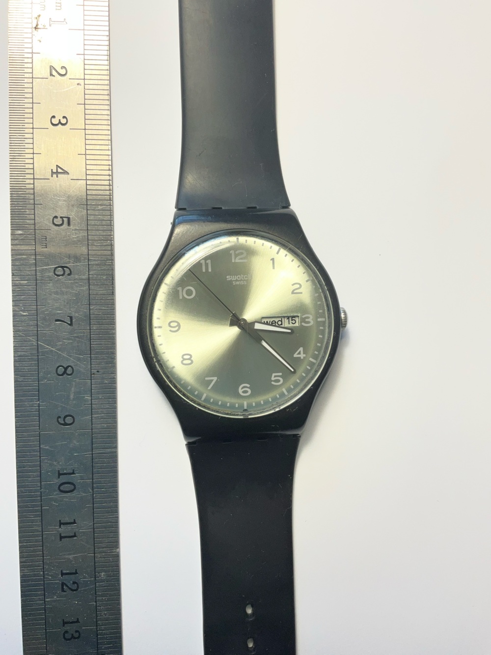 Swatch Silver Sunburst Dial Black Strap Watch